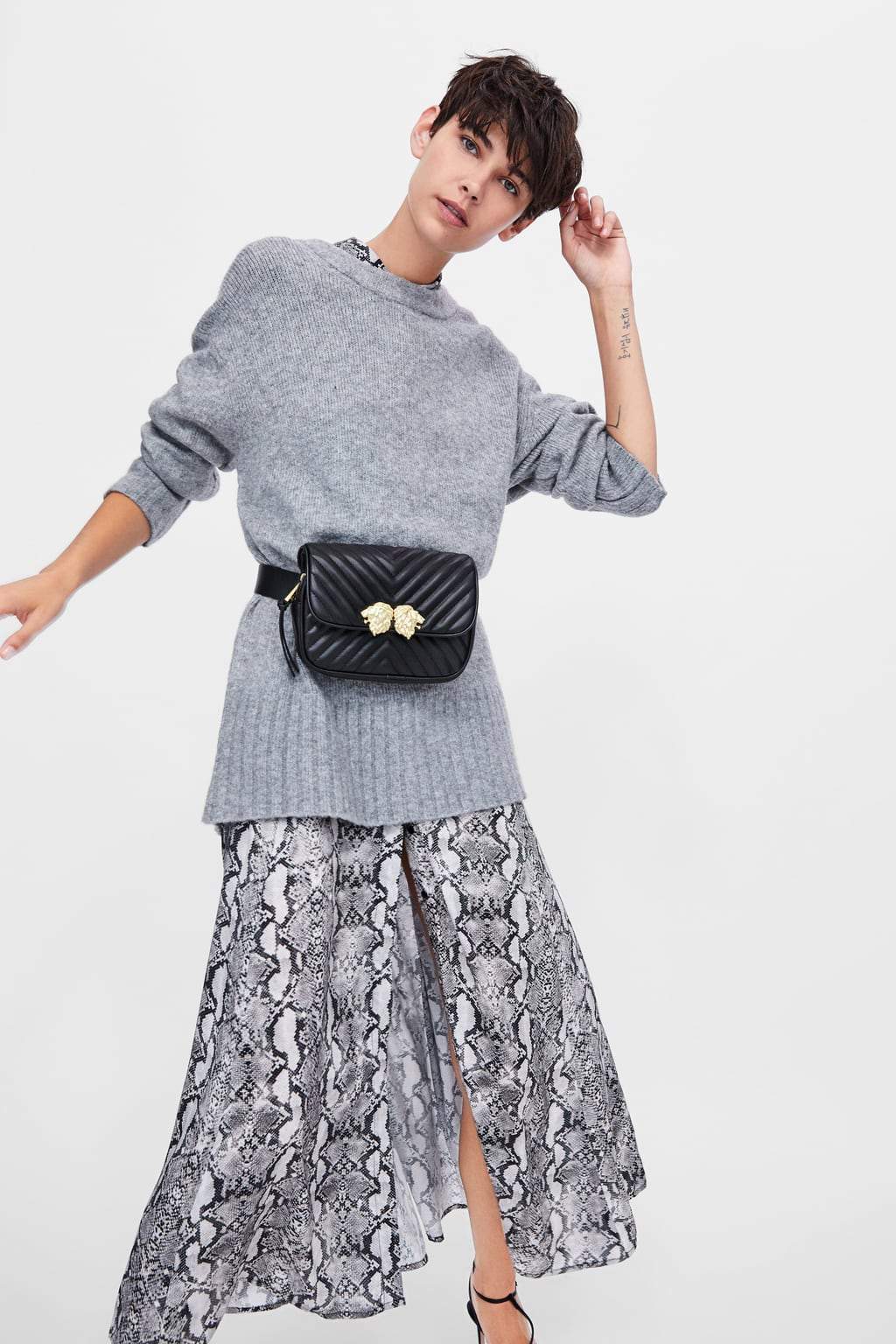 CROSSBODY BELT BAG WITH LION DETAILS